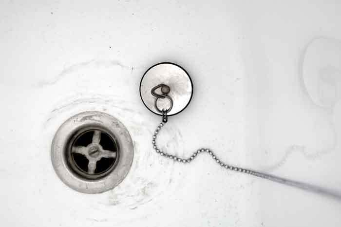 how to clear a clogged tub drain naturally