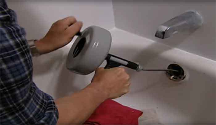 How To Snake A Tub Drain Not What You, How To Use A Snake Unclog Bathtub Drain