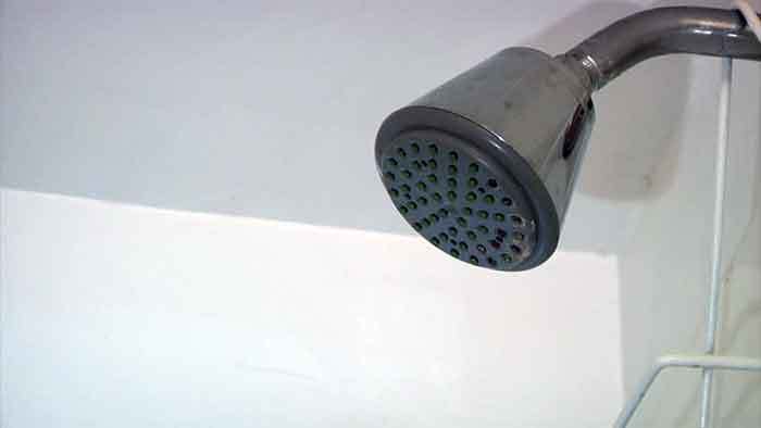 how to remove a shower head that is glued on