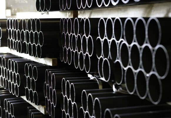 pipes stacked in warehouse