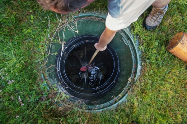 Cleaning and unblocking septic system. View from above.