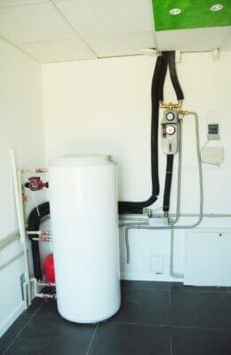 Boiler room with solar water heater tank for house energy effici
