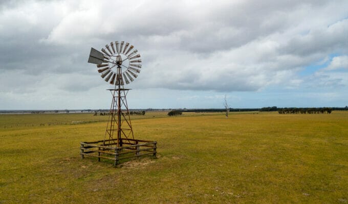 old windmill water pump in the field aerial photo